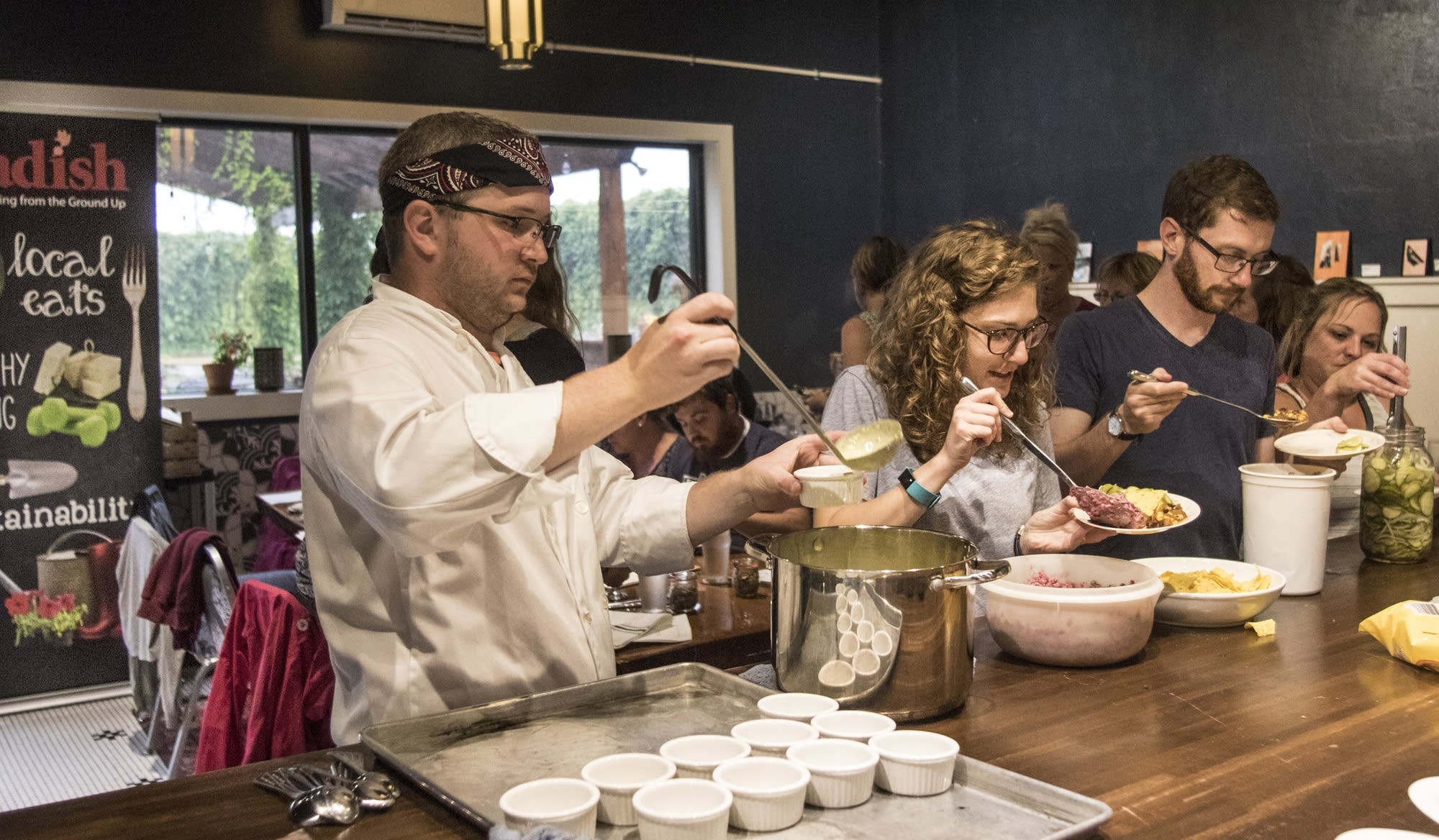 Chef David Bredesen serves up bowls of a hot pickle soup.