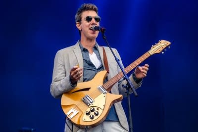 hamilton leithauser and his band performing on stage