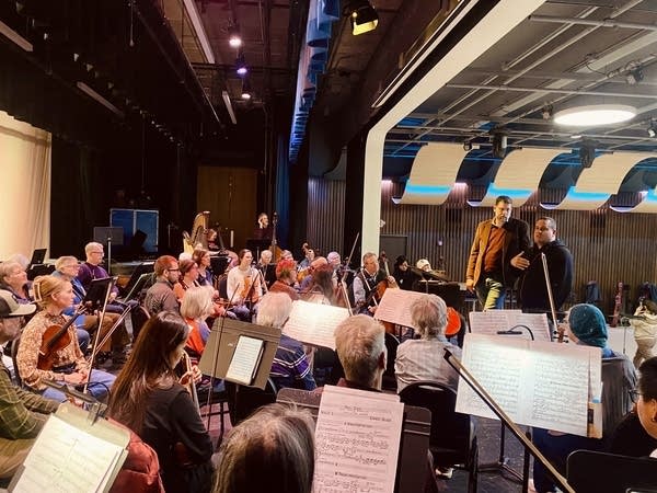 Musicians perform at a rehearsal.