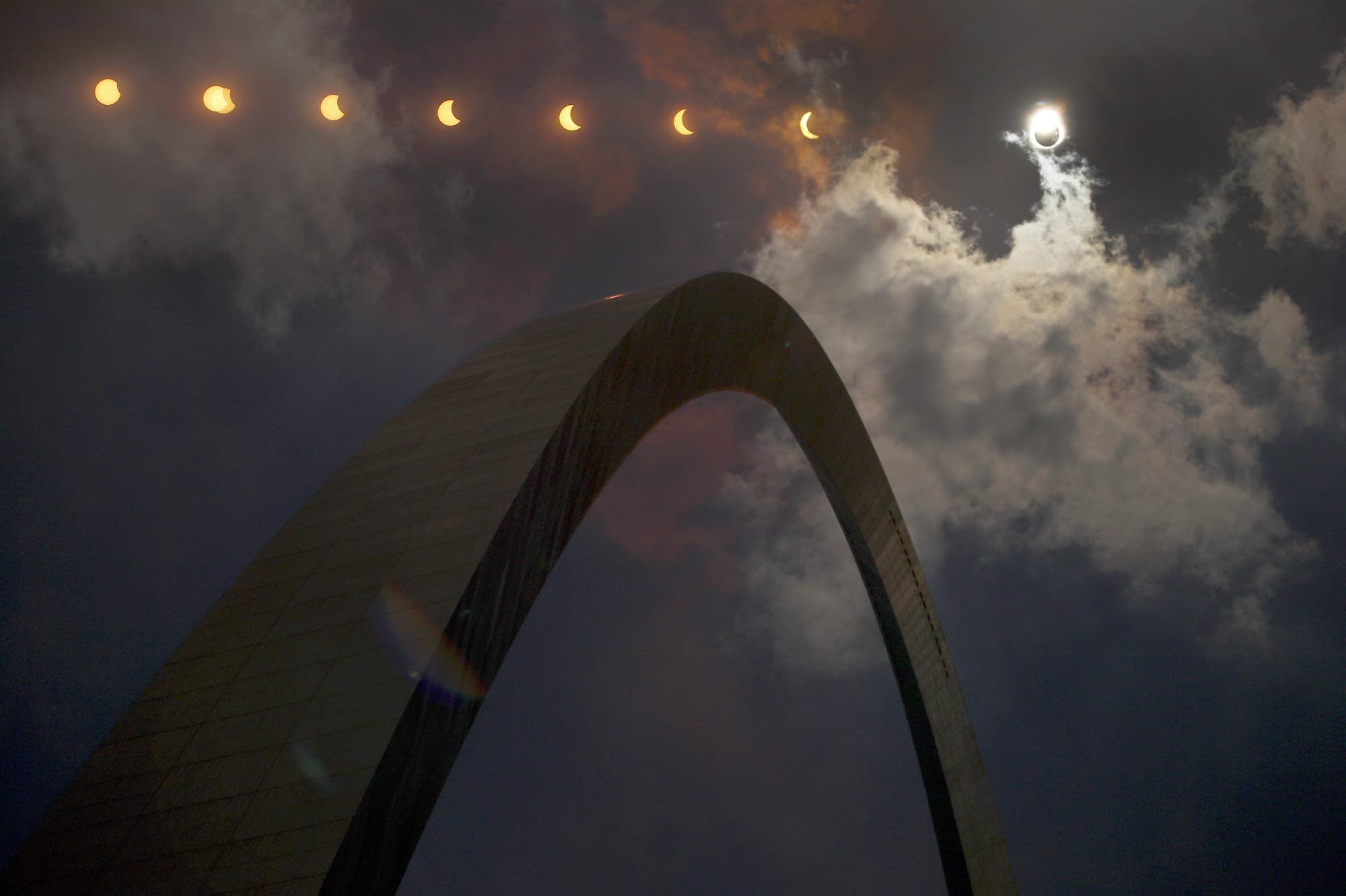 The phases of the eclipse pass over the Gateway Arch in St. Louis.