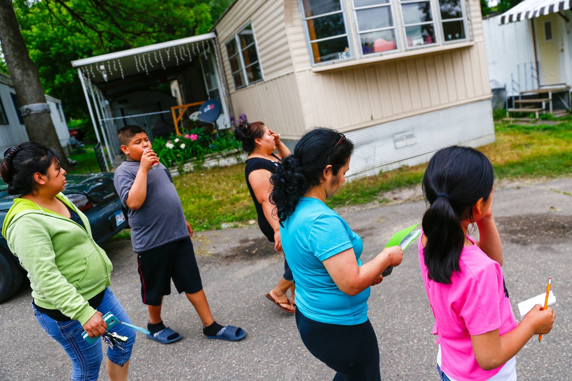 Residents look for petition signatures.