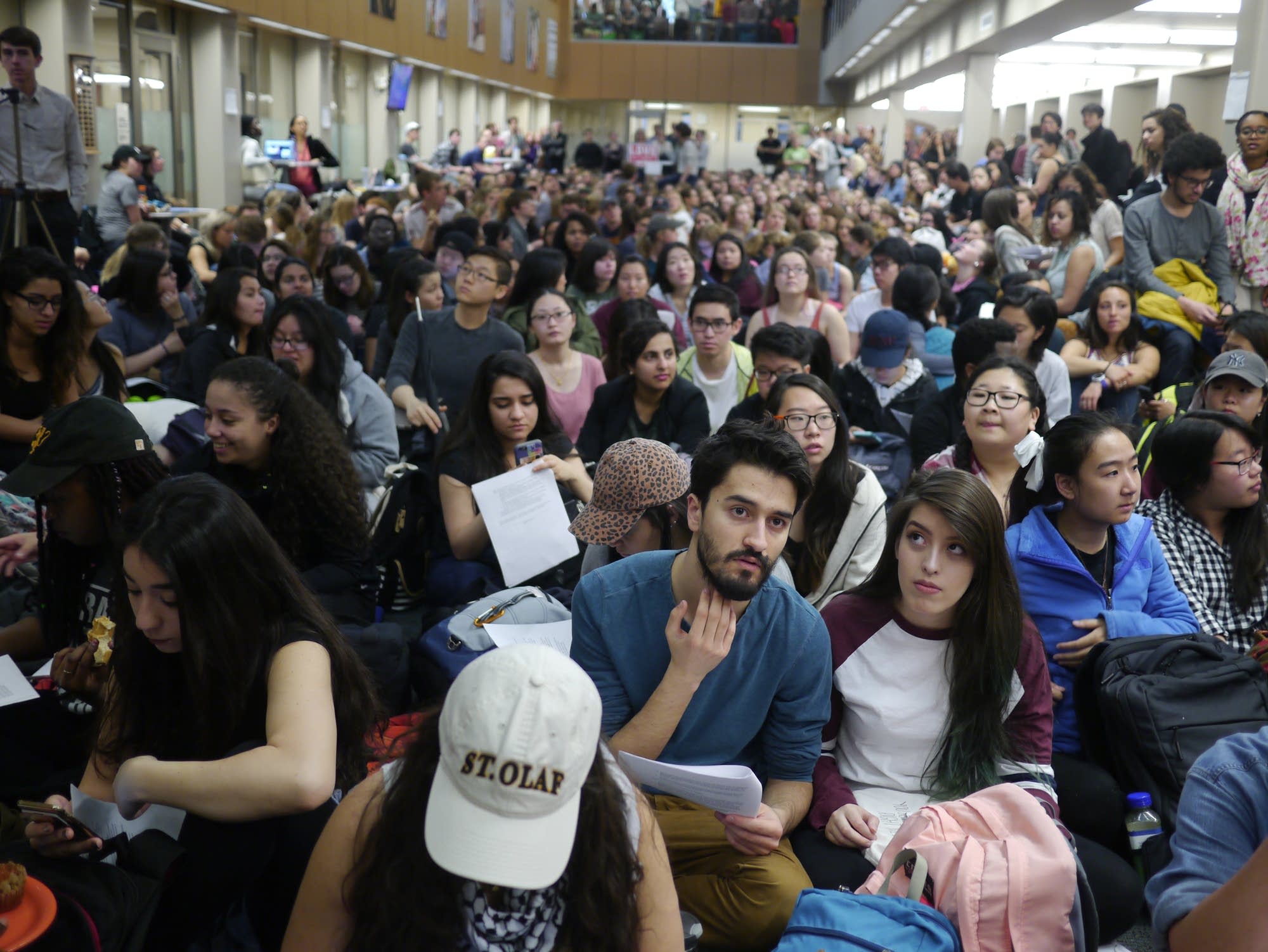 Students pack the atrium of the school's admin building