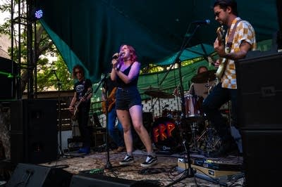 a band performing on an outdoor stage