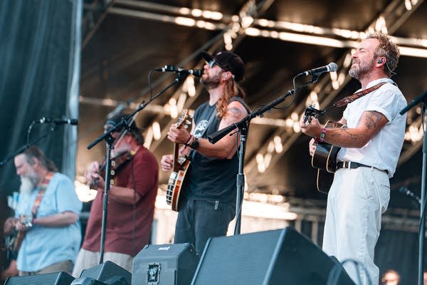 A string band performing on an outdoor stage