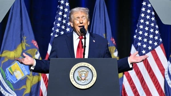 Above, President Donald Trump speaking at the Detroit Economic Club on Tuesday.