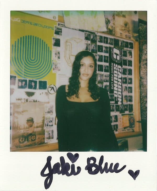 a signed polaroid with a woman in it