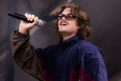 Common People performing on an outdoor stage.