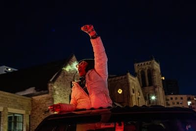 People protest during a caravan.