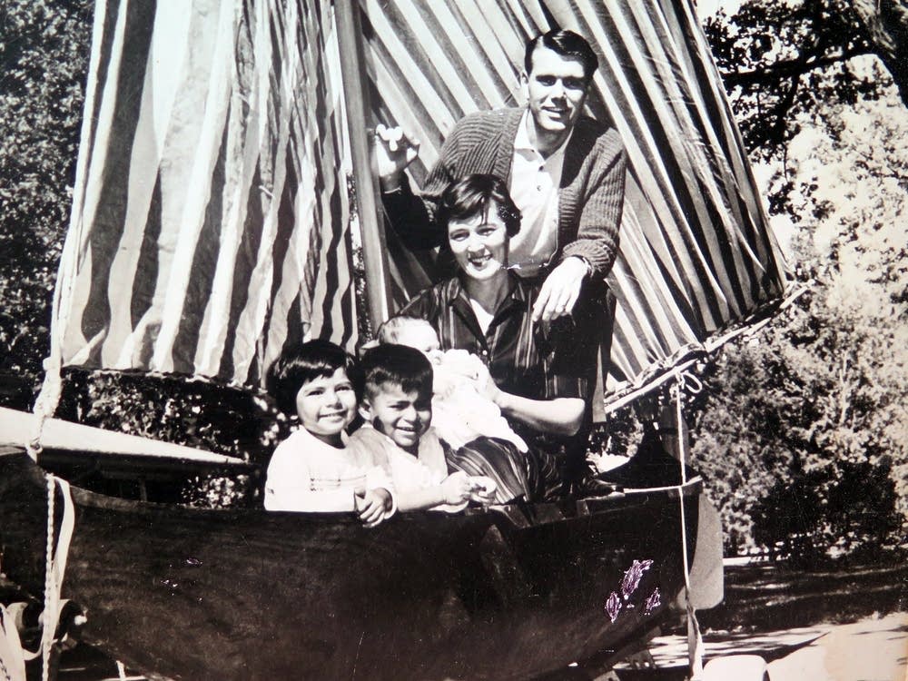 The Brooks family posed in a dugout canoe.