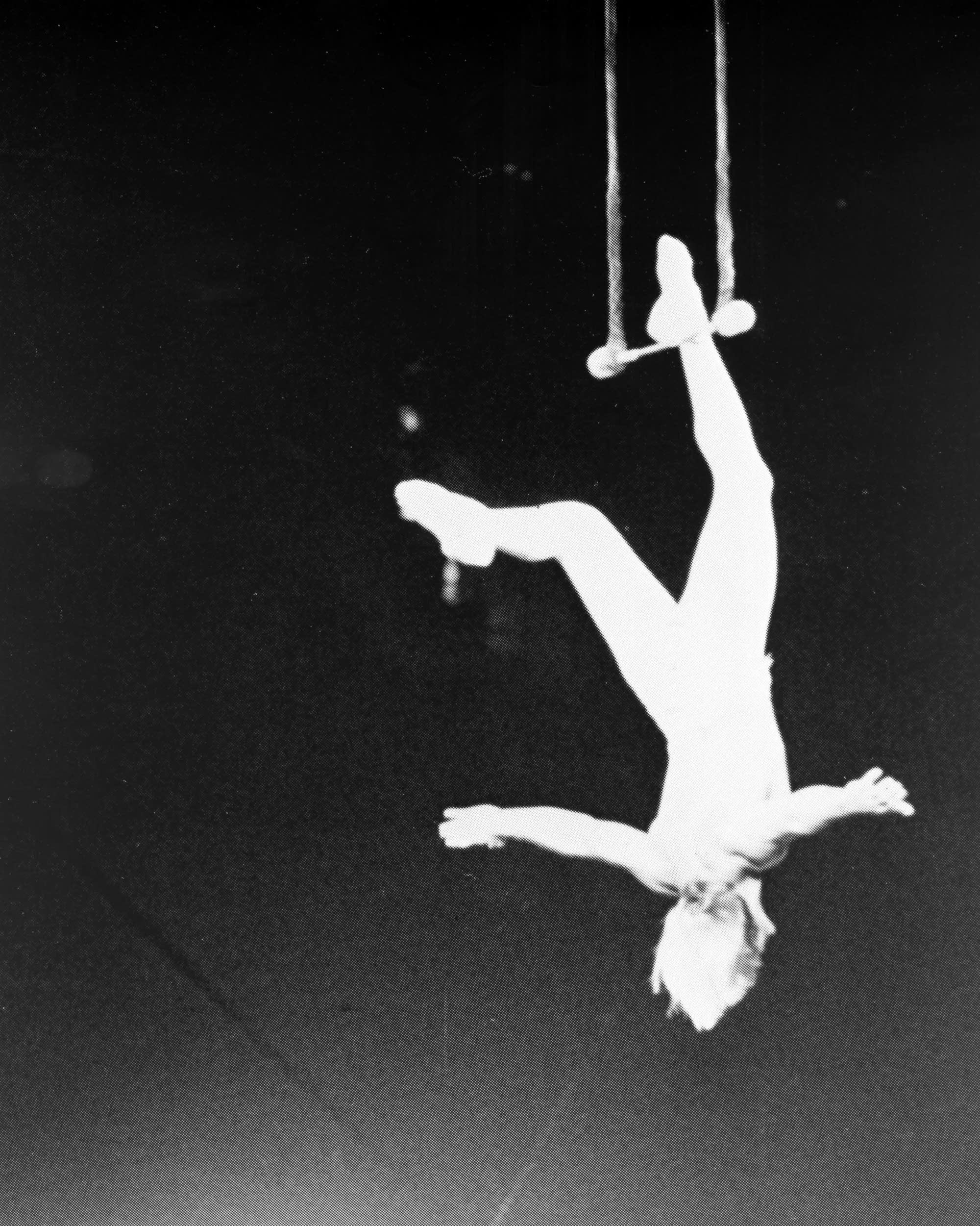 Dudley Riggs dangling from the trapeze in the early 1950s.