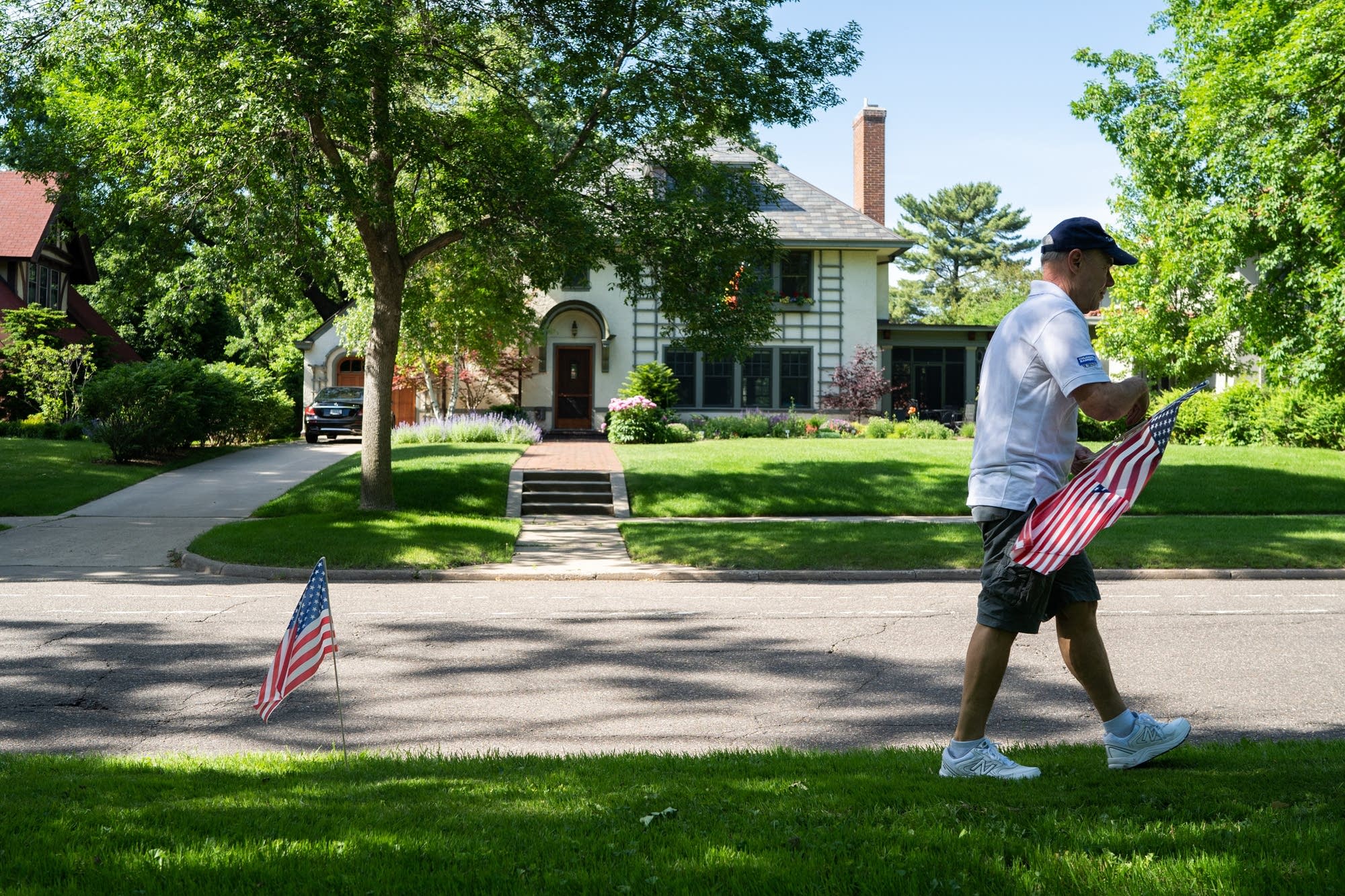 Tom Edelstein walks to the next spot where he'll plant a flag.