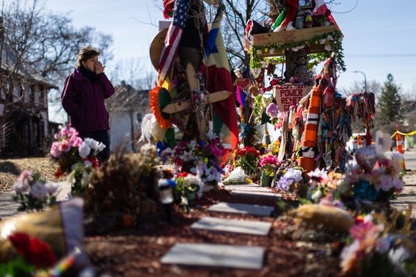 A woman visits a memorial