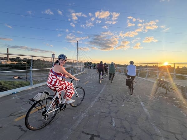 A woman rides a bike