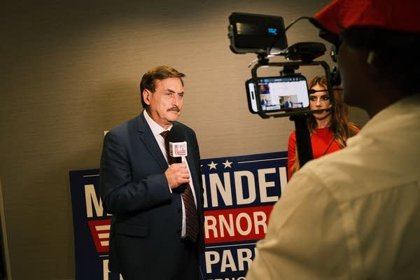 A man talks with a microphone