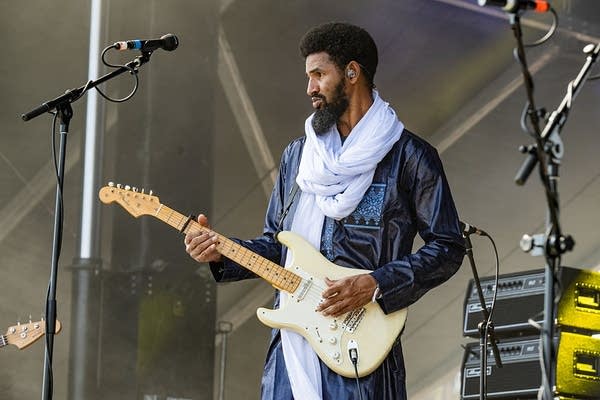 Mdou Moctar playing guitar on stage