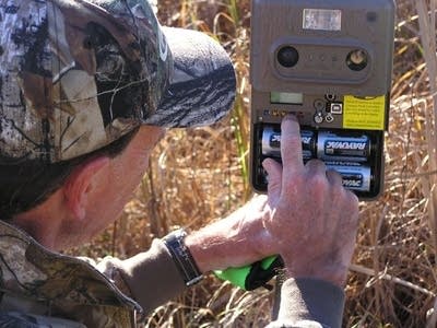 Bill Marchel and one of his trail cameras