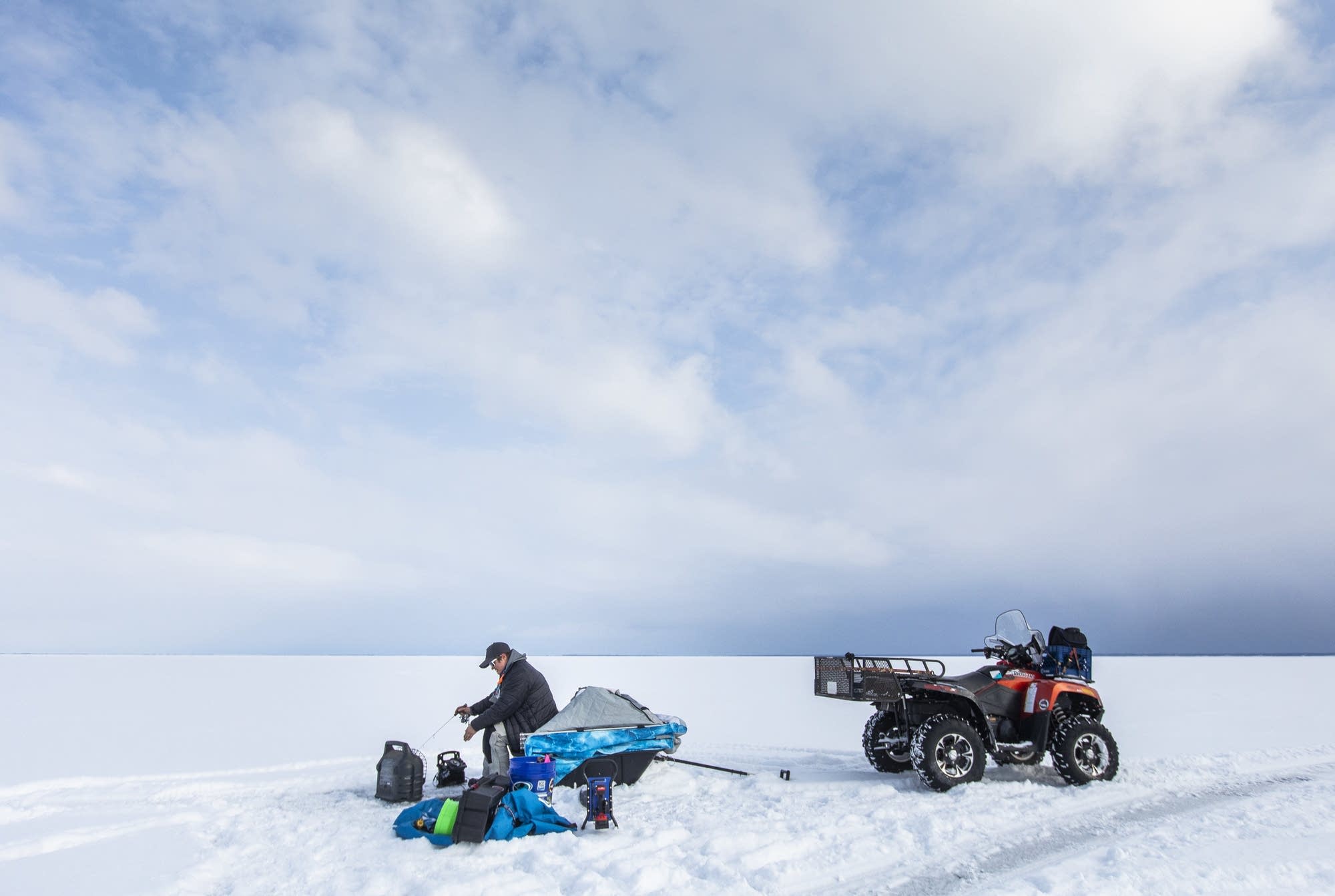 Rikki Pardun ice fishes on Lake Superior near Washburn, Wis.