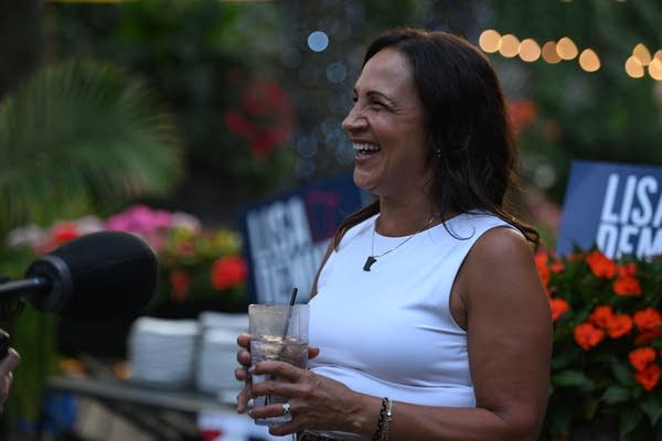 A woman smiles