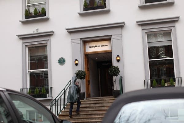 A musician enters Abbey Road Studios in St John's Wood on March 5, 2012 in London, England.