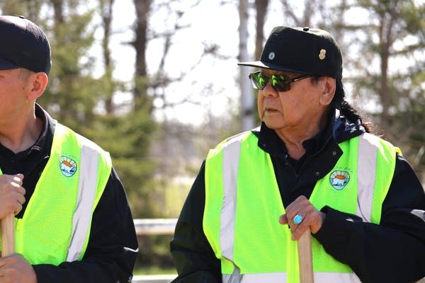 Darrell Seki Sr. wearing a black hat and reflection vest