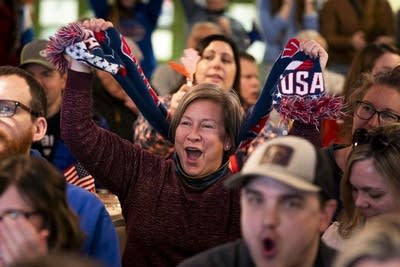 people watching the olympics and cheering