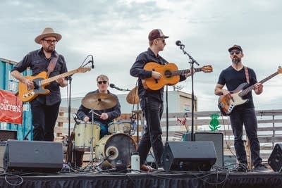 A band performing at a social event at a craft brewery
