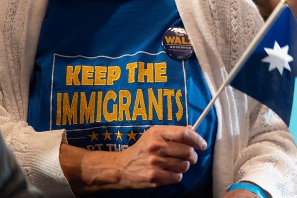 person wears t shirt with 'keep the immigrants' slogan