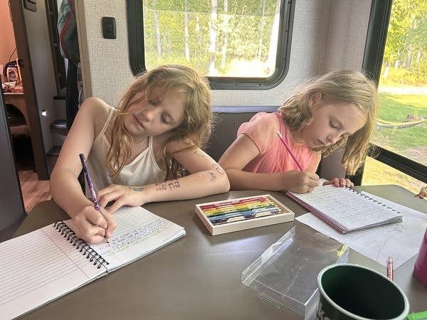 two children doing schoolwork