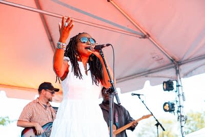 A band performing on an outdoor stage