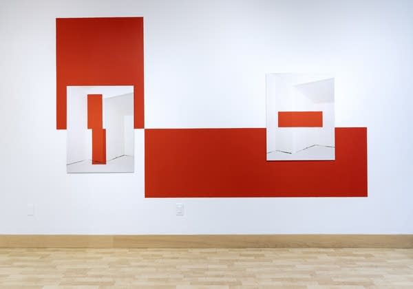 A wall with red and white paint