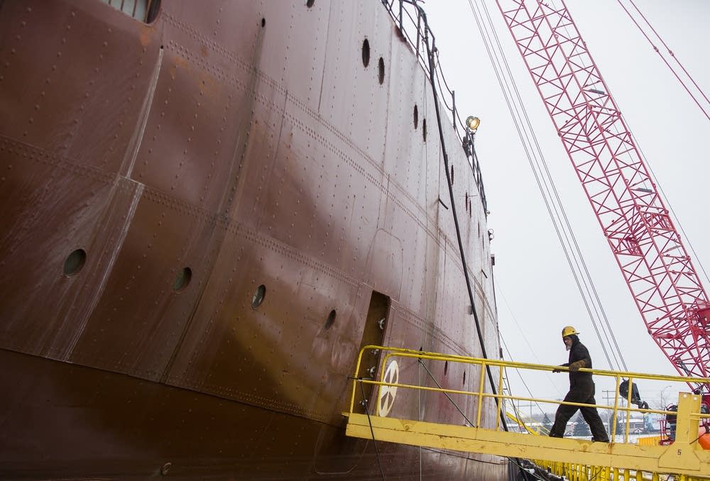 A worker enters the Kaye E. Barker