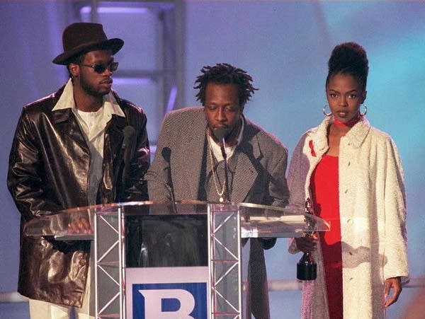 U.S.-based band Fugees accept their Brit Award for Best International Group at the annual pop music awards night held in London on February 24, 1997.