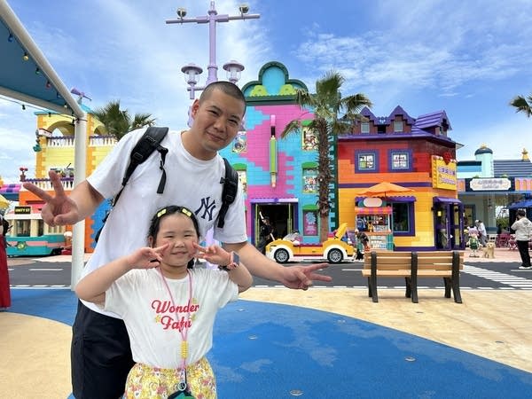 Wang Puguang and his five-year-old posing at Legoland Shanghai
