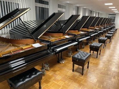 A vast showroom filled with pianos