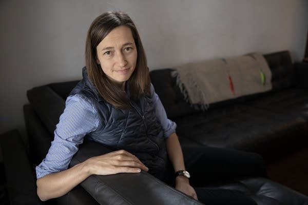 A woman sitting on a couch.