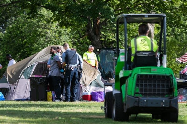 Squad is arrested by Minneapolis Park Police outside his tent.