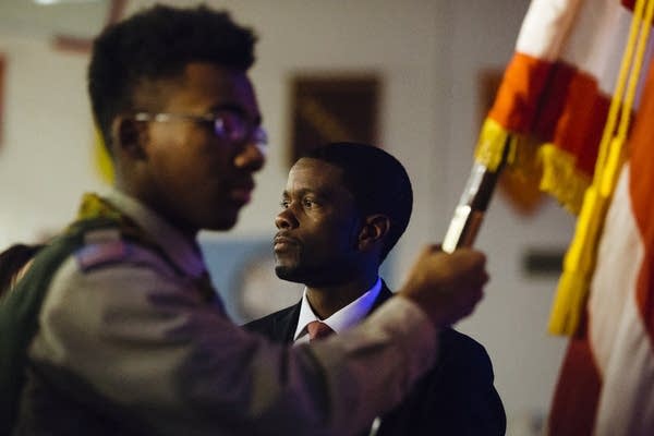 St. Paul Mayor Melvin Carter watches the color guard