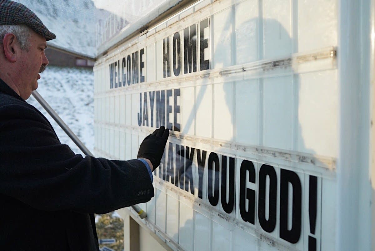 Floyd Lunde changes the sign outside of First Baptist Church.