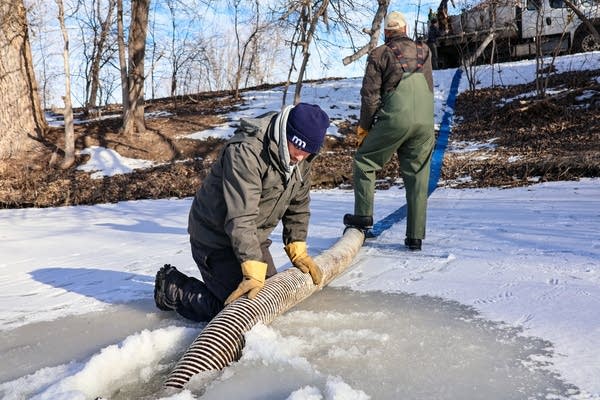 people ice fishing