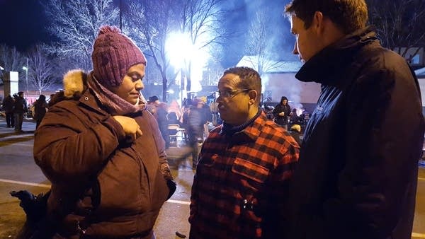 Rep. Keith Ellison talks to demonstrators