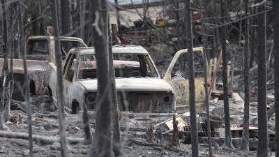 Firefighters work to battle the Stewart Trail wildfire.