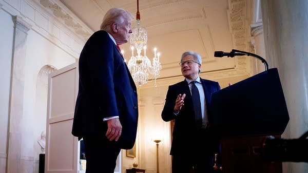 Nvidia CEO Jensen Huang speaks with President Trump at the White House. 