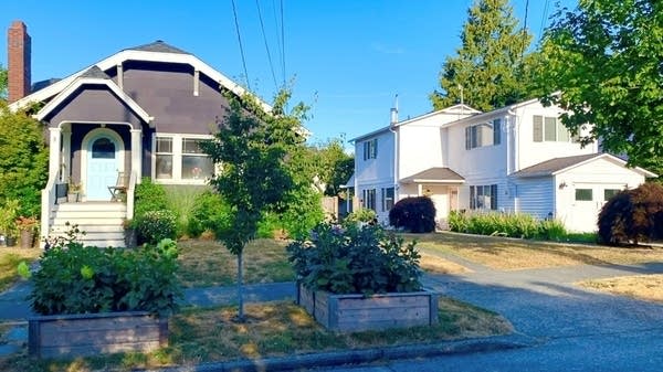 The house owned by Bonnie Rough and family (left) next to the short-term rental she operates under the name "Peach Street Farm."