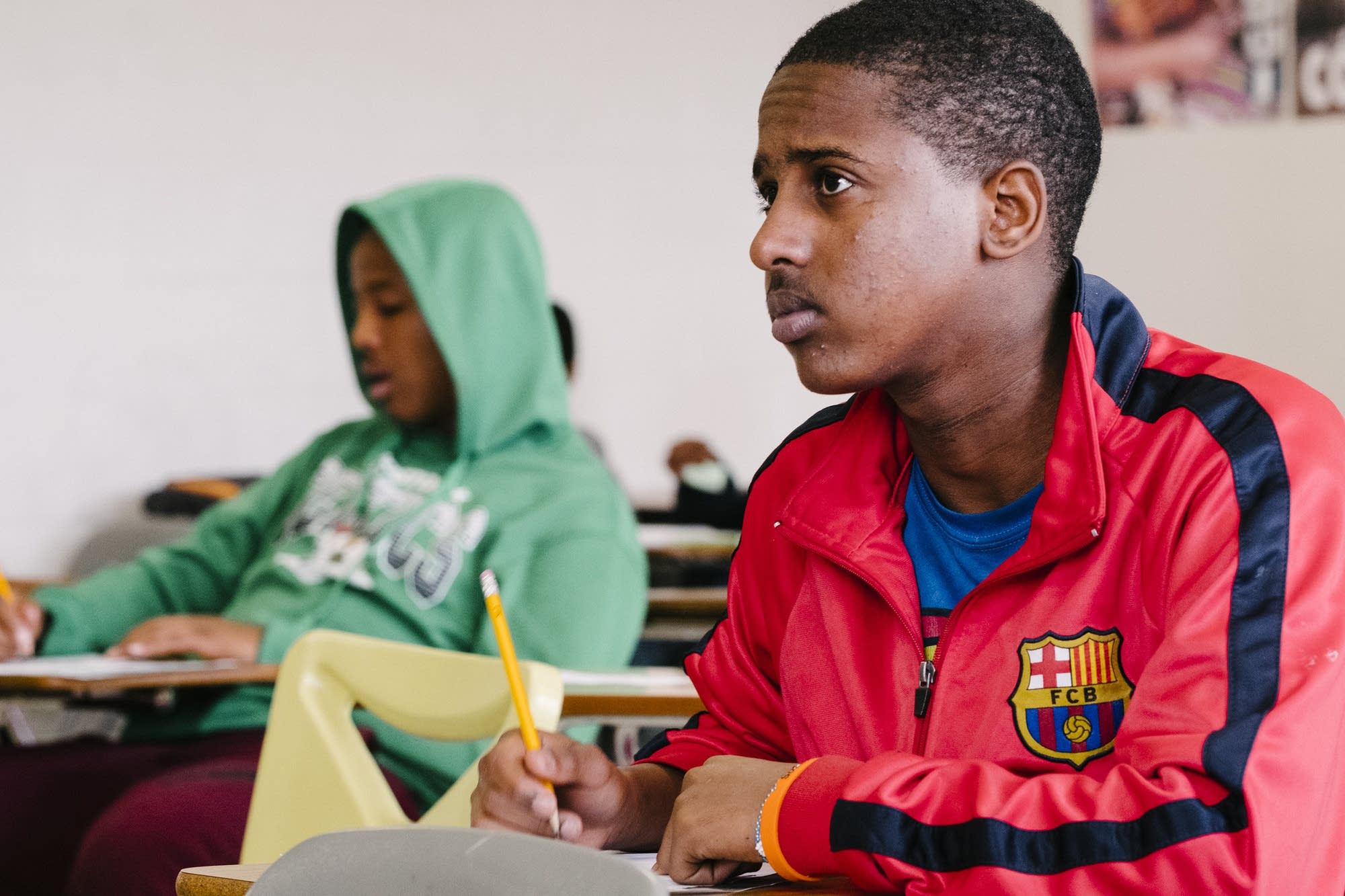 Two students listen in their Somali language class.