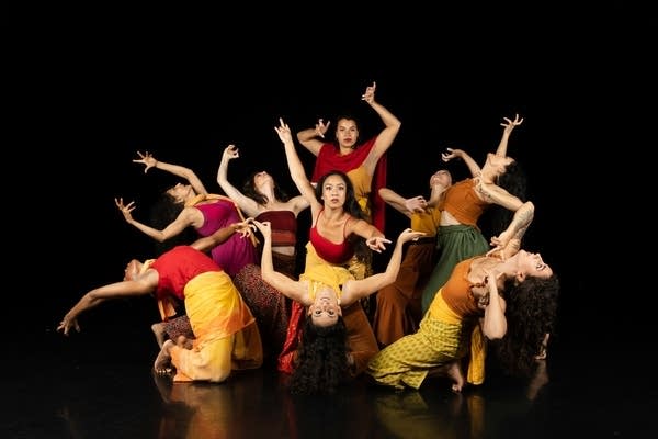 Dancers pose for a photo.