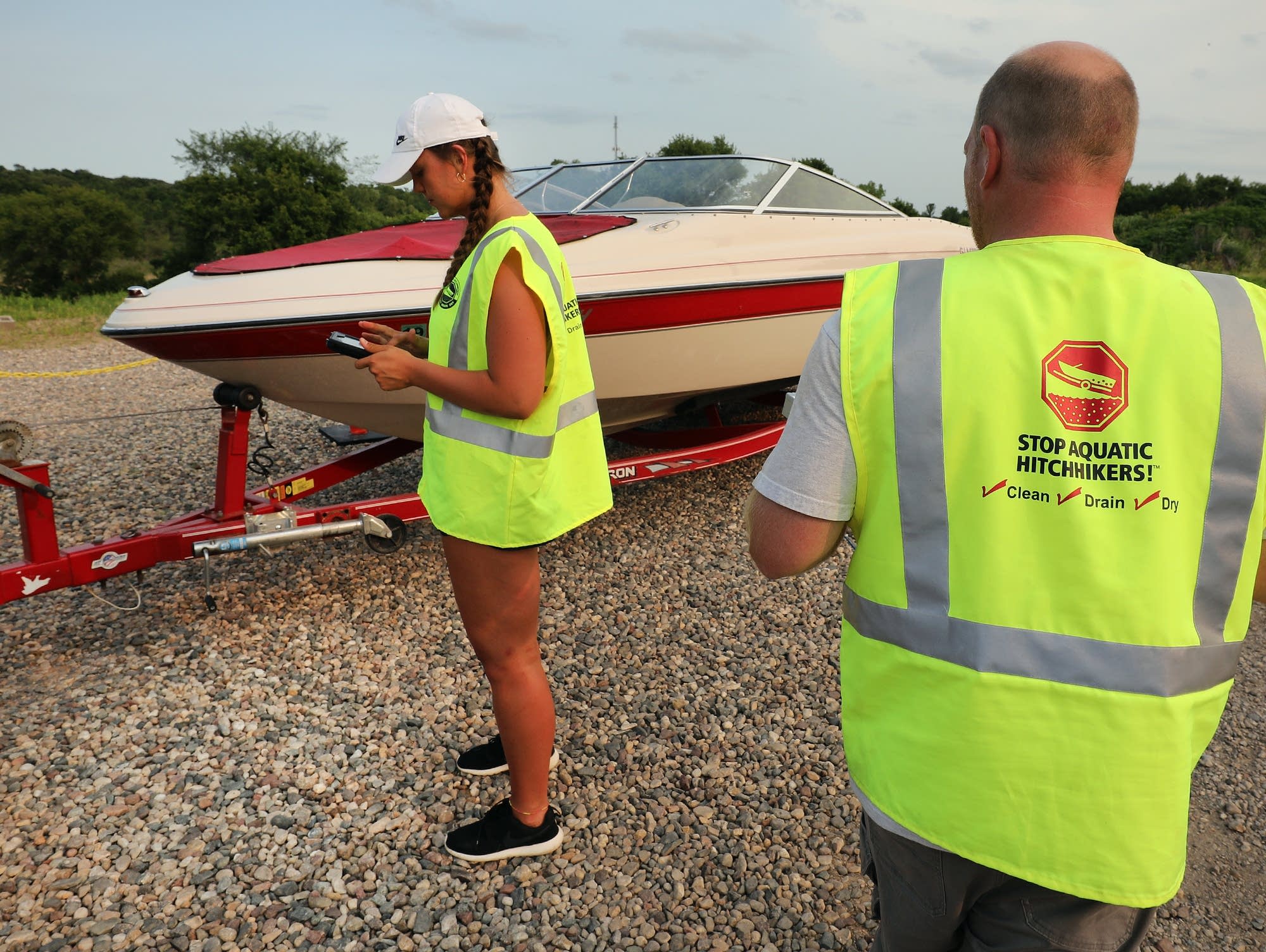 Bradley Hansen (right) and Hannah Purcell inspect a boat.
