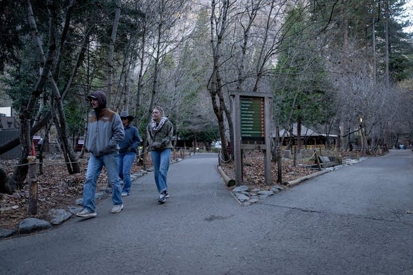 People walk on a trail in a national park.