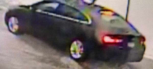 A low resolution image of a black car.