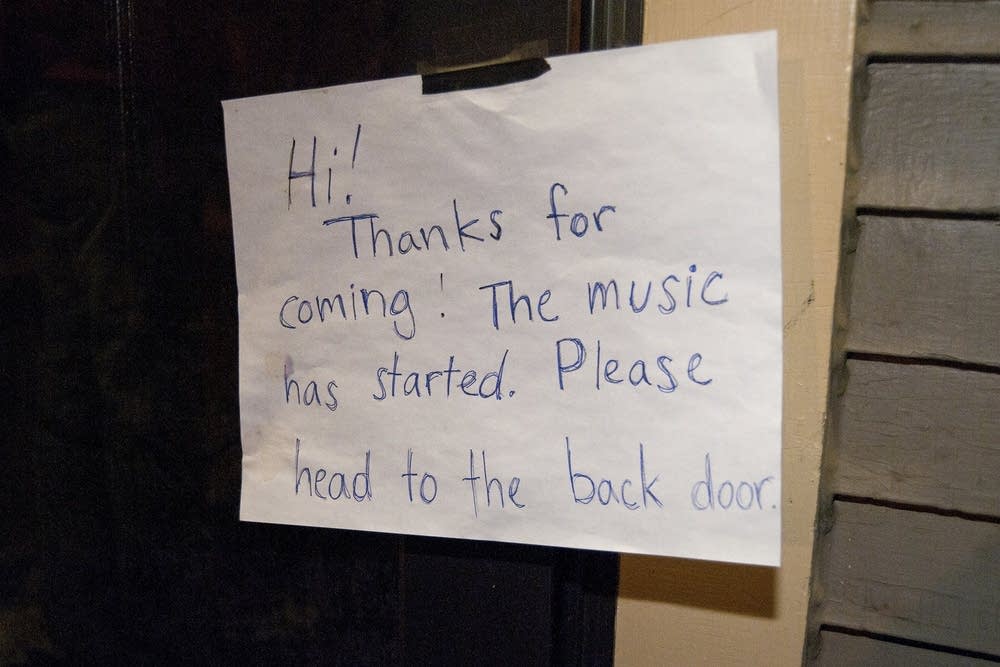 A sign on the front door of the concert.