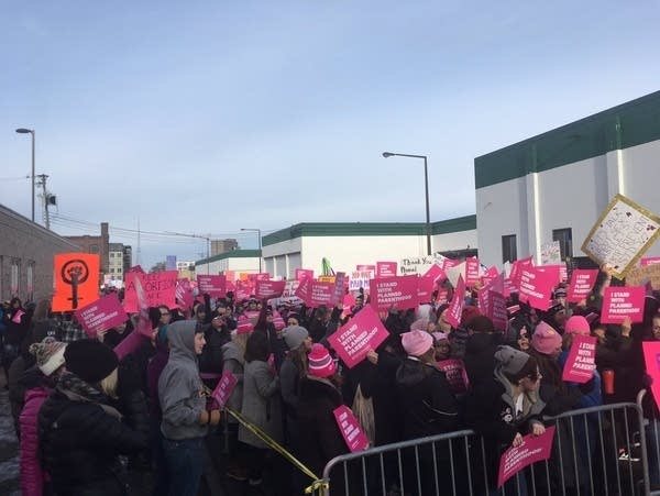 Thousands of people rally in support of Planned Parenthood this winter.